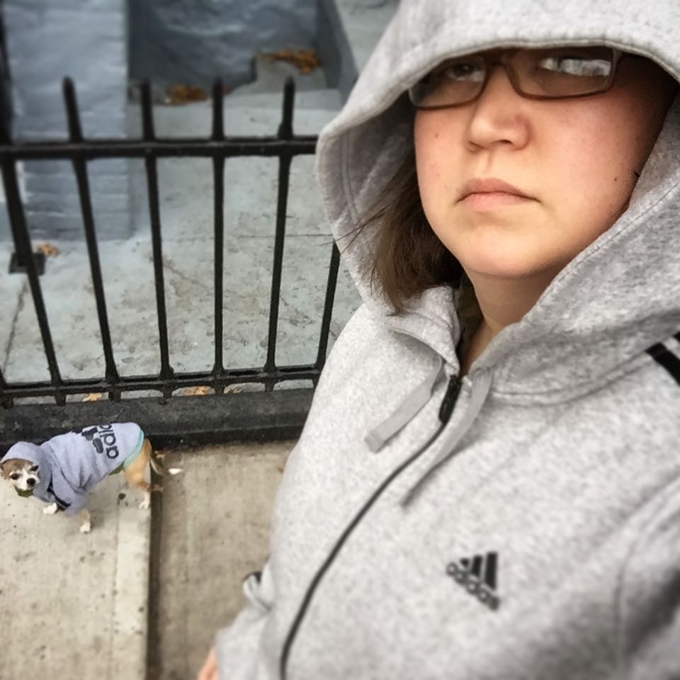 Phaedra & her dog, Effie, wearing matching hoodies.